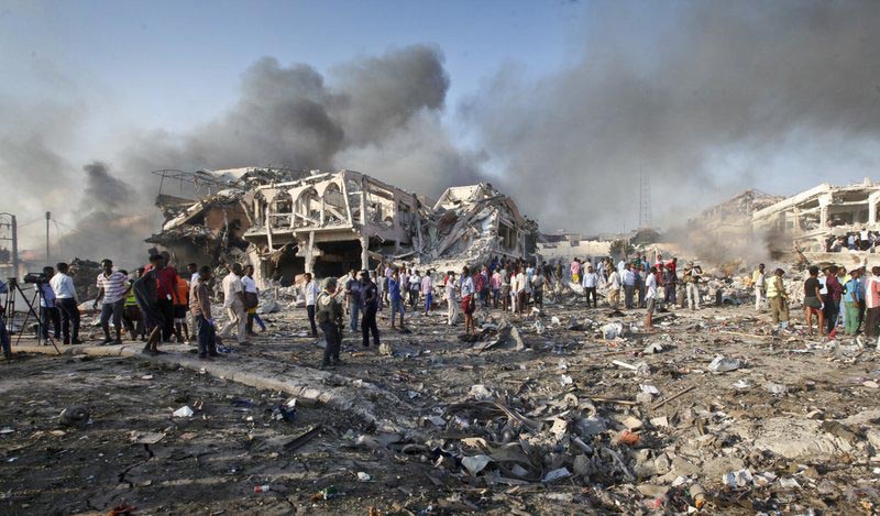 Somalis gather and search for survivors by destroyed buildings at the scene of a blast in the capital Mogadishu, Somalia, on Saturday, October 14, 2017. Photo: AP