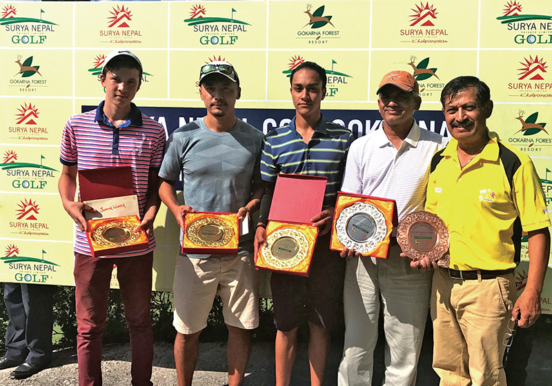 (From left) Sam Doublard, Tashi Dong, Prithvi Malla, Dr Bhagwan Koirala and Gopal Chitrakar hold the trophies after the Surya Nepal Gokarna Monthly Medal at the Gokarna Golf Club in Kathmandu, on Saturday. 
