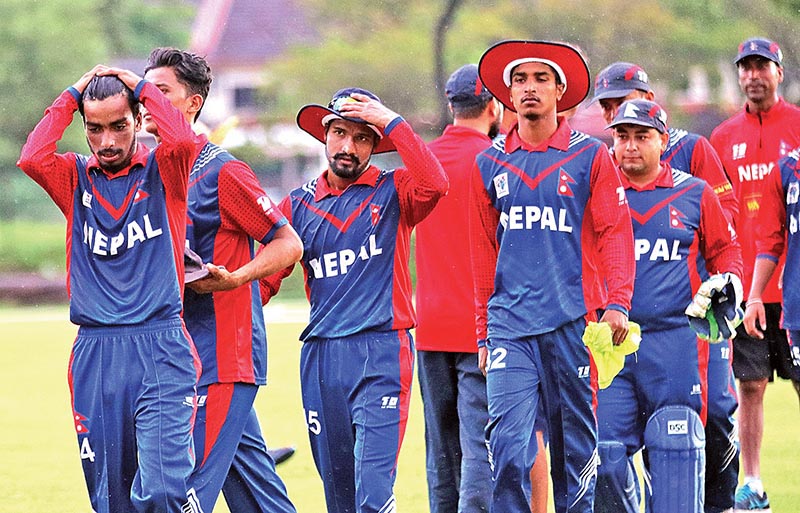 Dejected Nepali youth cricketers walk off the field after the ACC U-19 Youth Asia Cup match against Bangladesh at the Kinrara Oval in Kuala Lumpur on Saturday. Photo Courtesy: NSJF