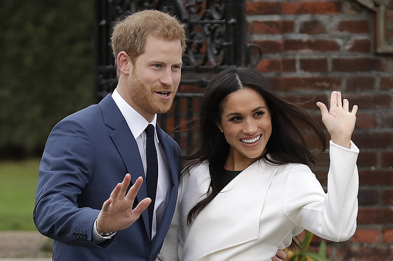 Britain's Prince Harry and his fiancee Meghan Markle pose for photographers during a photocall in the grounds of Kensington Palace in London, Monday Nov. 27, 2017. Photo: AP