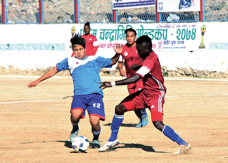 Players of NIBL  Friends Club and CMG Club Sankata (right) vie for the ball during their Chandragiri Gold Cup match at the Naikap grounds in Kathmandu on Saturday. Photo: THT