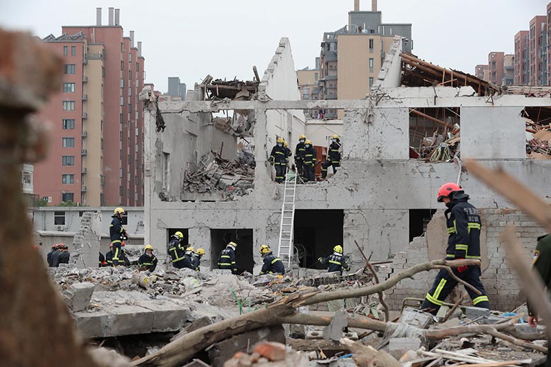 Rescue workers work at the site of a blast in Ningbo, Zhejiang province, China, on  November 26, 2017. Photo: Stringer via Reuters
