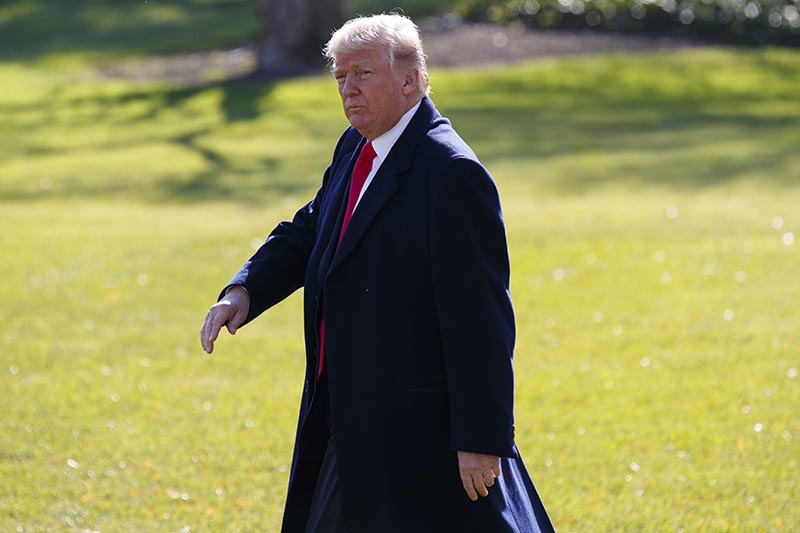 President Donald Trump walks to board Marine One on the South Lawn of the White House,  in Washington, on Wednesday, November 29, 2017. Photo: AP
