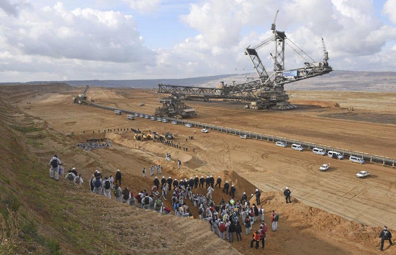 Anti-coal demonstrators gather near the surface mining Hambach, near Kerpen, Germany, Sunday, November 5, 2017 one day ahead of the opening of the UN Climate Summit in Bonn, Germany. Photo: AP