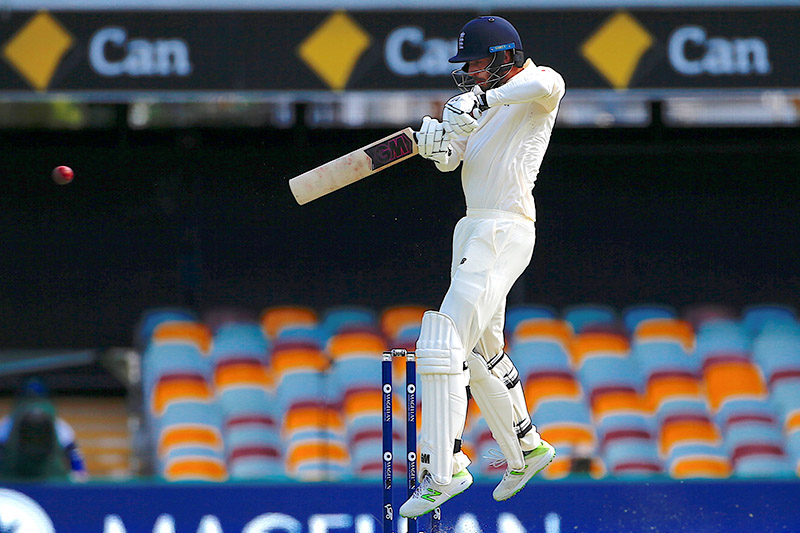 England's James Vince hits a boundary during the first day of the first Ashes cricket test match. Photo: Reuters