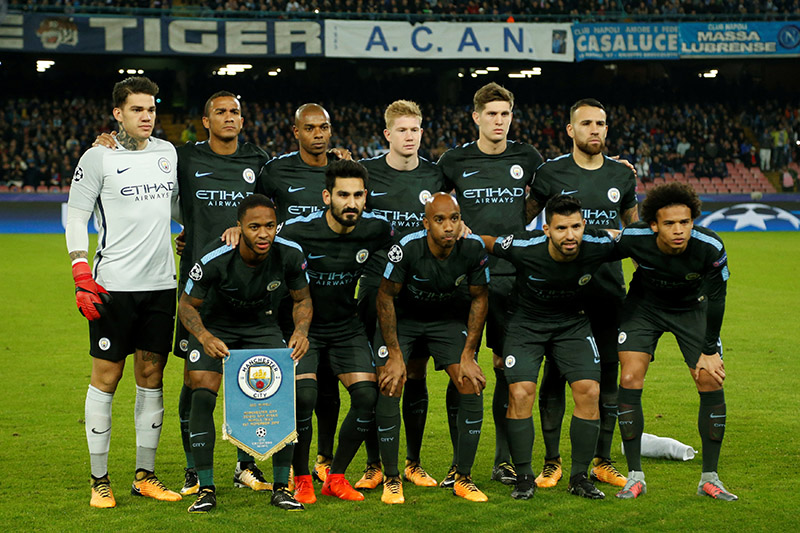 Manchester City pose for a team group photo before the match. Photo: Reuters