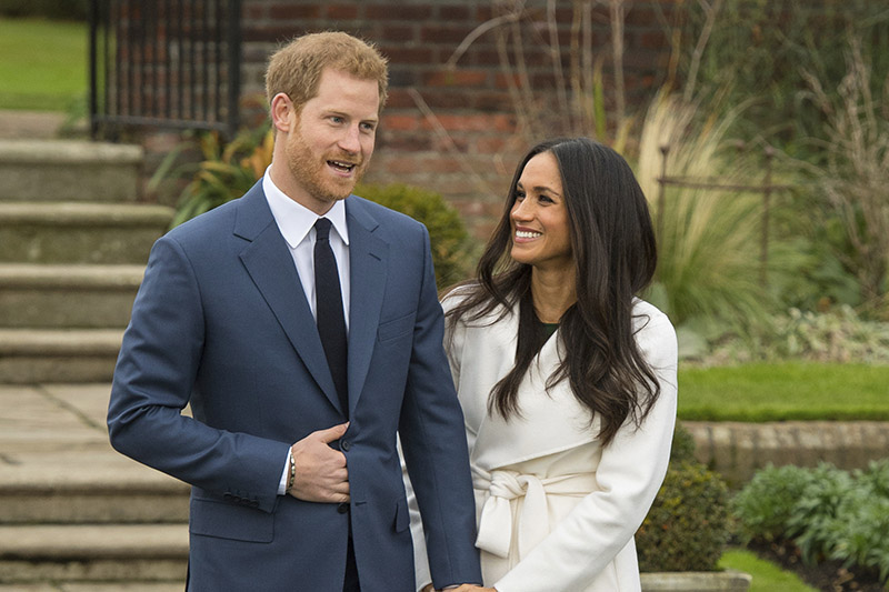 Britain's Prince Harry and Meghan Markle  pose for the media in the grounds of Kensington Palace in London, Monday Nov. 27, 2017. Photo: AP