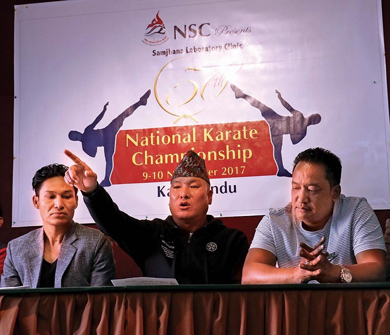 Nepal Karate Federation President Dawa Gurung speaks as event coordinator Deepak Shrestha (left) and Samjhana Laboratory President Urdeep Joshi look on during a press meet in Kathmandu on Monday. Photo: THT
