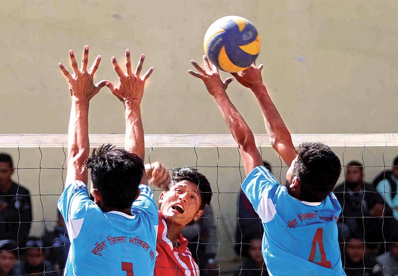A player of Newton School jumps for a spike against Surkhet Volleyball Association during their first PABSON U-18 National VolleyballTournament match in Kathmandu on Thursday. Photo: THT