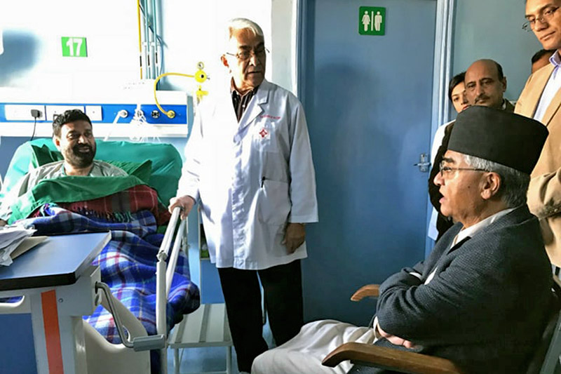 PM Sher Bahadur Deuba enquiring about Bimalendra Nidhi's health with a doctor at OM Hospital, Kathmandu, on Wednesday, November 22, 2017. Photo: Ramjee Dahal