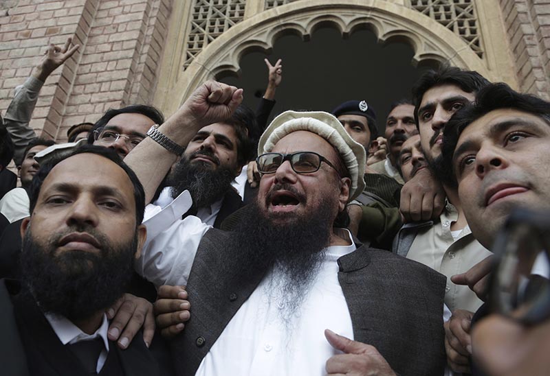Hafiz Saeed, head of the Pakistani religious party, Jamaat-ud-Dawa, gestures outside a court in Lahore, Pakistan, on Wednesday, November 22, 2017. Photo: AP