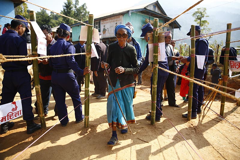 A 94-year-old woman on her way to cast vote at a polling station during the first phase of parliamentary and provincial elections in Phidim Municipality, Panchthar district, on Sunday, November 26, 2017. Photo: Skamda Gautam/THT