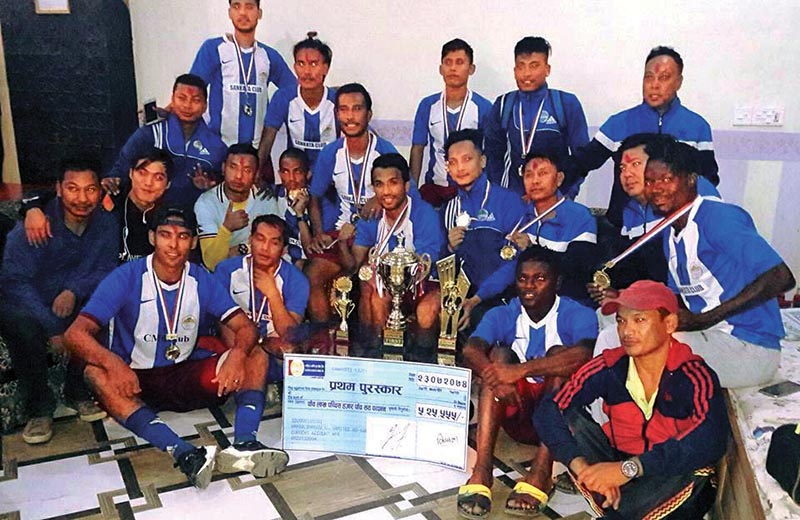 Players and officials of CMG Club Sankata pose for a group photo after winning the Rhino Gold Cup in Nawalparasi on Thursday. Photo: THT