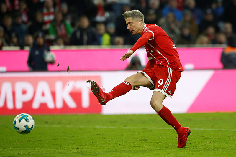 Bayern Munich's Robert Lewandowski scores their second goal. Photo: Reuters