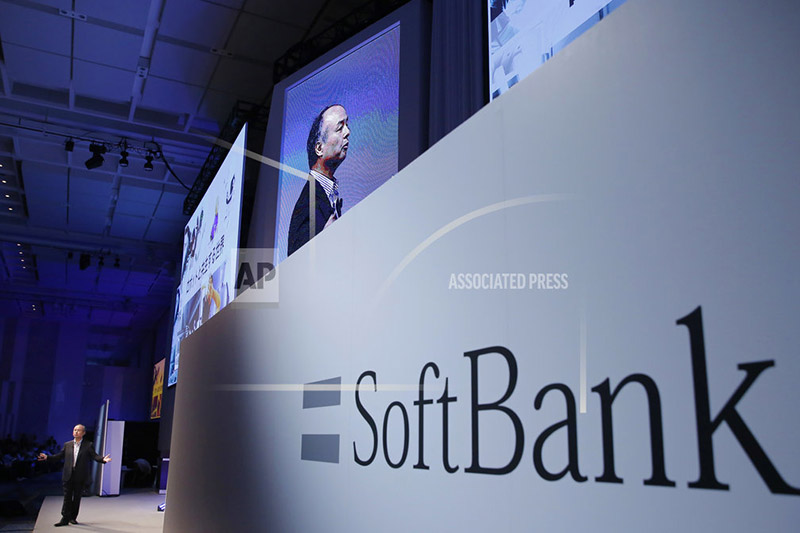 FILE - In this July 20, 2017, file photo, SoftBank Group Corp. Chief Executive Officer Masayoshi Son, left, speaks during a SoftBank World presentation at a hotel in Tokyo. Photo: AP