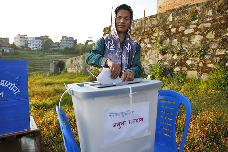 A Visually impaired participant votes during a mock election for the upcoming elections organised by the Election Commission Nepal with support from UNDP's Electoral Support Project to familiarise the visually impaired participants from 70 districts with the specifics of the voting process in Dhulikhel at Kavrepalanchowk District, Nepal on Tuesday, November 14, 2017. Photo: Skanda Gautam/THT