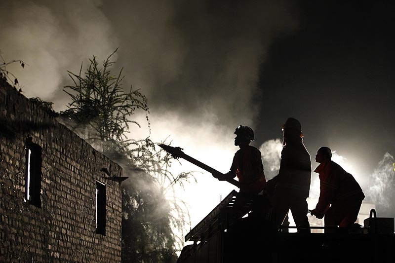 Firefighters work to extinguish a fire at Patan Industrial Estate in Lalitpur, Nepal, on Tuesday, November 14, 2017. Photo: AP