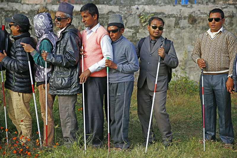 Differently-abled persons queue to cast their votes during a mock election. Photo: Skanda Gautam/THT
