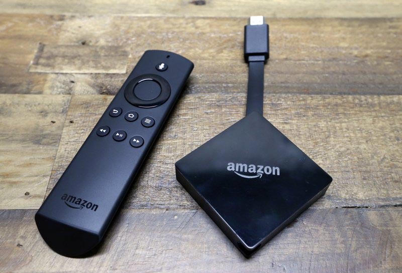 An Amazon Fire TV streaming device with its remote control, Wednesday, September 27, 2017. Photo: AP/ File