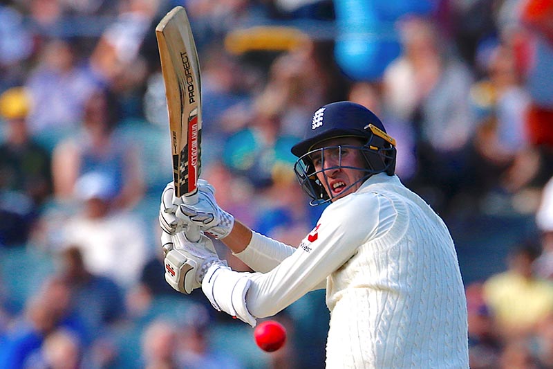 England's Craig Overton hits a boundary during the third day of the second Ashes cricket test match between Australia and England, at Adelaide Oval, in Adelaide, Australia, on December 4, 2017. Photo: Reuters