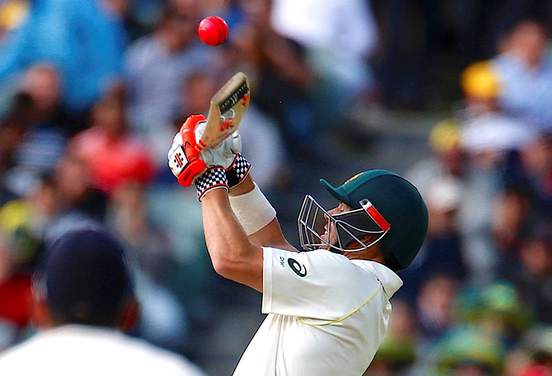 Australia's David Warner tries to hit a shot during the first day of the second Ashes cricket test match between Australia and England, at Adelaide Oval, in Adelaide, Australia, on December 2, 2017. Photo: Reuters