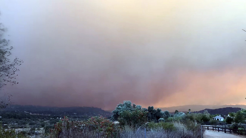 Smoke caused by the Santa Paula fire in Ventura County, California, US December 5 , 2017, in this still image taken from social media video. Photo:   GAVIN GARRISON via REUTERS