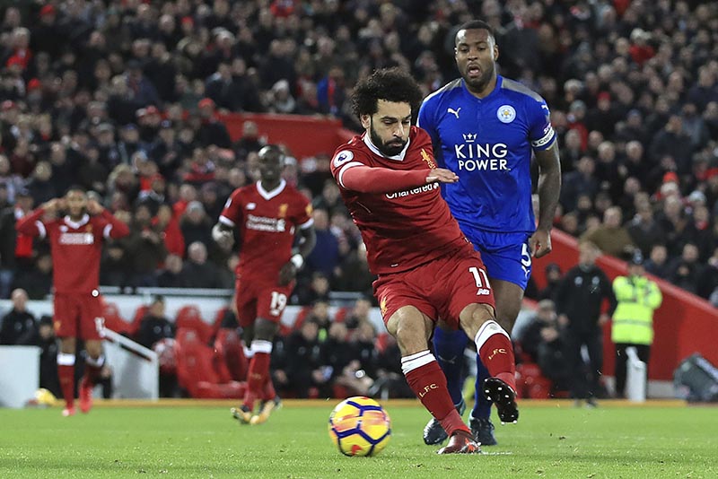  FILE: Liverpool's Mohamed Salah scores his side's first goal against Leicester City during the English Premier League soccer match at Anfield, Liverpool, England, on Saturday December 30, 2017. Photo: Peter Byrne/PA via AP