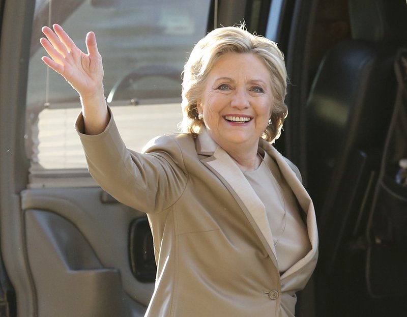 In this Nov. 8, 2016 file photo, Democratic presidential candidate Hillary Clinton waves as she arrives to vote at her polling place in Chappaqua, N.Y. Vanity Fair is trying to defuse criticism of a video mocking Clinton and her presidential aspirations. In a statement Wednesday, Dec. 27, 2017, the magazine said the online video was an attempt at humor that regrettably u201cmissed the mark.u201d 