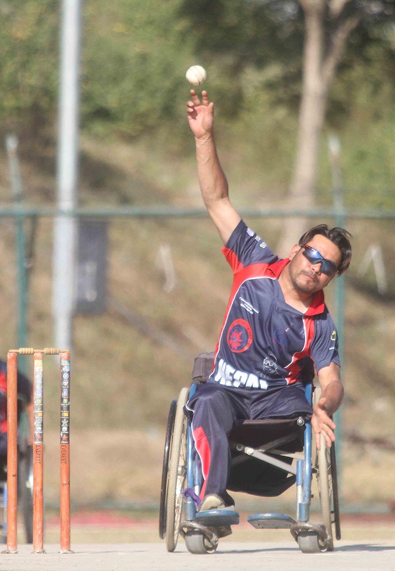 Nepalu2019s Yam Bahadur Shrestha bowls against Bangladesh during the first International Wheelchair Cricket Tournament in Kathmandu, on Thursday, December 14, 2017. Photo: Udipt Singh Chhetry/THT