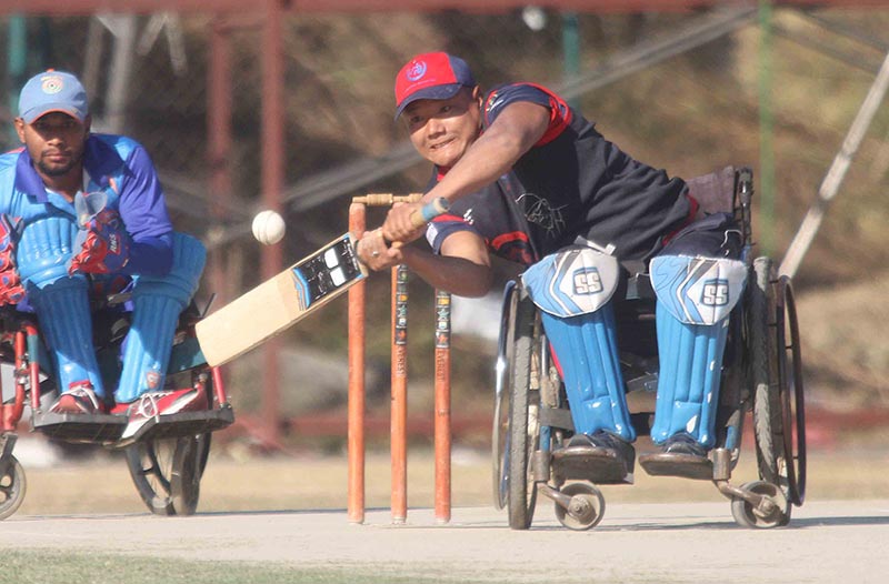 Nepalu2019s Digam Chemjong Limbu bats against India during their first International Wheelchair Cricket Tournament match at the TU Stadium in Kathmandu on Friday, December 15, 2017. Photo: Udipt Singh Chhetry/THT