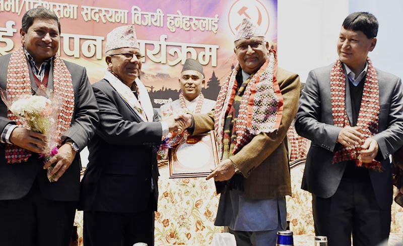 CPN-UML Chair KP Sharma Oli congratulating party senior leader Madhav Kumar Nepal on being elected member of the Parliament, in Kathmandu, on Wednesday, December 20, 2017. Photo: THT.