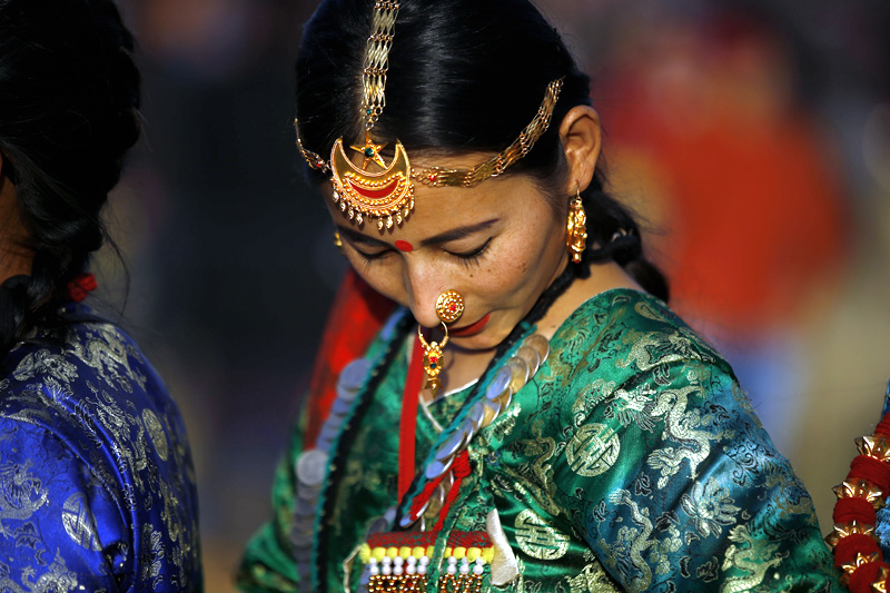 A Nepali woman from Kirat community dressed in traditional attire performs Sakela dance during Udhauli festival in Kathmandu, on Saturday, December 09, 2017. Photo: Skanda Gautam