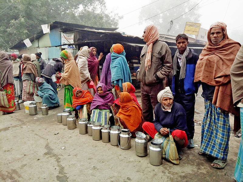 Local famers await customers to sell their milk at a haat bazaar in Rajbiraj of Saptari district, on Thursday, December 28, 2017. Photo: Byas Shankar Upadhyay