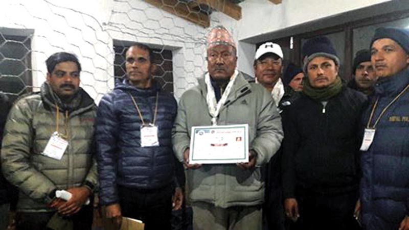 Left alliance candidate Prem Prasad Tulachan (centre)showing his certificate after being elected member of Parliament, in Mustang, on Friday. Photo: THT