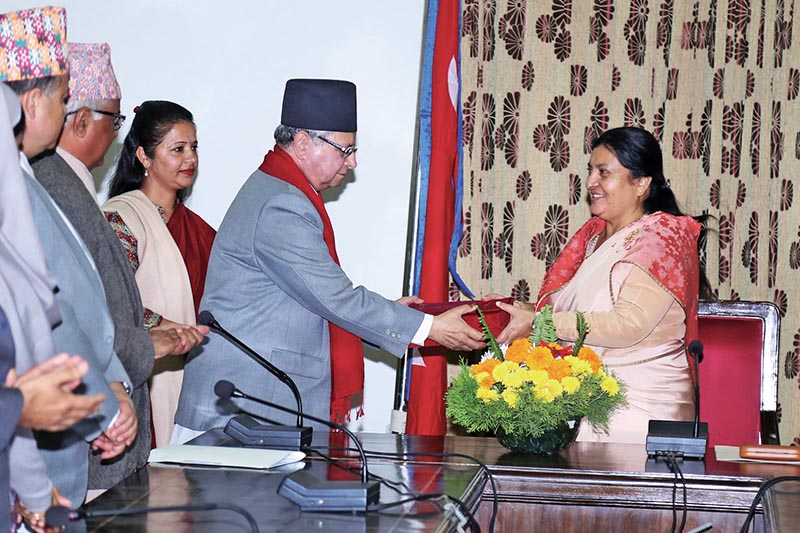 National Human Rights Commission Chairman Anup Raj Sharma submitting annual report of the rights body to President Bidhya Devi Bhandari, in Shital Niwas, on Friday. Photo: RSS