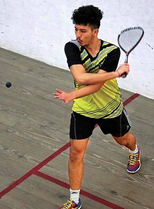 Arhant Keshar Singh in action against Dilip Singh Adhikari during their menu2019s singles match of the 10th National Squash Tournament in Lalitpur on Monday. Photo: THT