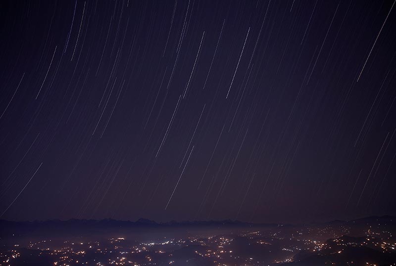 A long exposure picture shows a star trail above the mountain range during the Geminids meteor shower celestial event in Nagarkot, Nepal, on December 14, 2017. Photo: Reuters