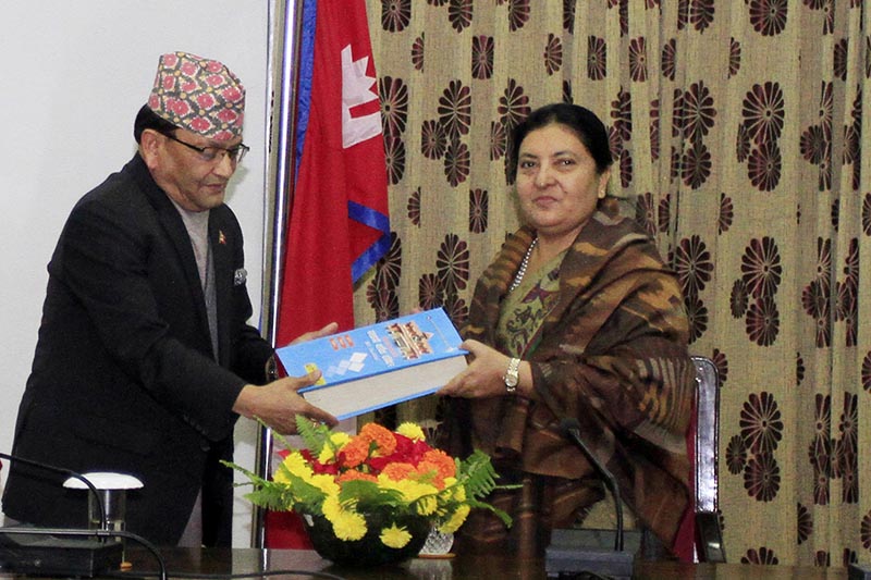 President Bidya Devi Bhandari (right) receives annual report submitted by CIAA chief Deep Basnyat at Sheetal Niwas, in Kathmandu, on Thursday, December 14, 2017. Photo: RSS
