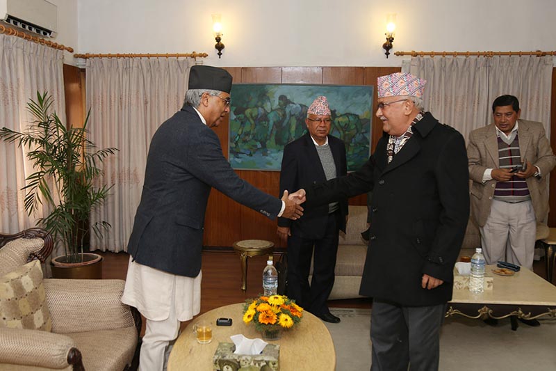 Prime Minister Sher Bahadur Deuba and CPN-UML Chairman KP Sharma Oli shaking hands at the five-party meet summoned by the PM, in Baluwatar, on Friday, December 22, 2017. Photo courtesy: PM's Secretariat