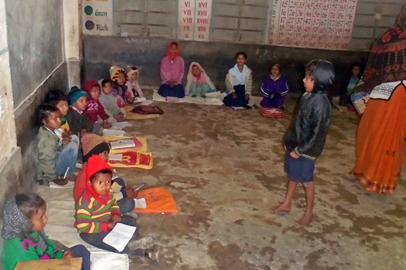 School children are seen studying sitting on the floor as cold wave hits Saptari district, in Chhinnamasta Rural Municipality of Saptari district. Photo: Byas Shankar Upadhyay