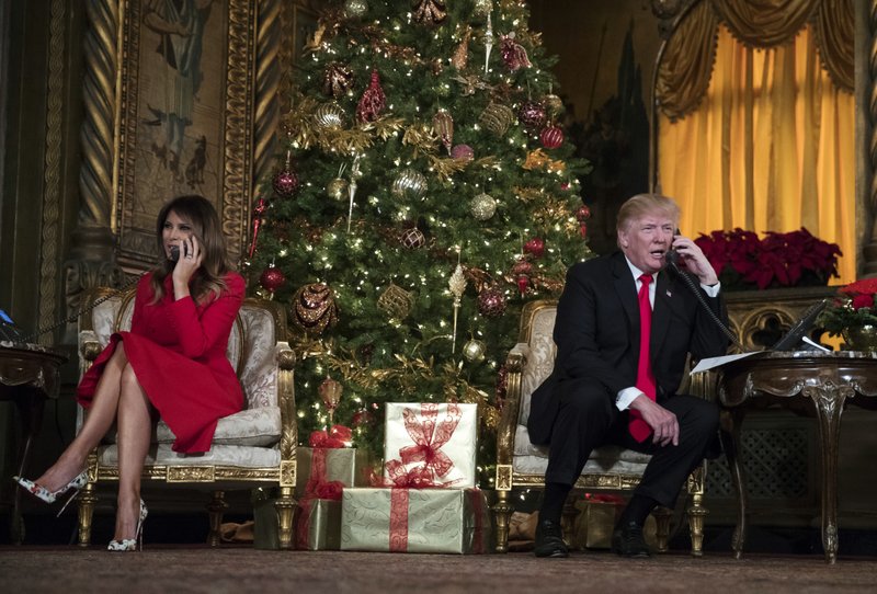 President Donald Trump and first lady Melania Trump speak on the phone with children as they track Santa Clausu2019 movements with the North American Aerospace Defense Command (NORAD) Santa Tracker on Christmas Eve at the presidentu2019s Mar-a-Lago estate in Palm Beach, Fla., Sunday, December 24, 2017. Photo: AP