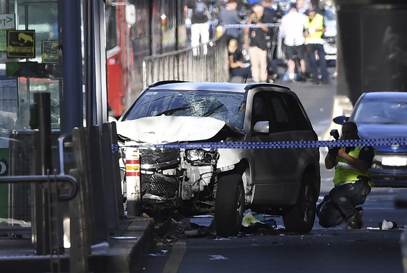 A damaged vehicle is seen at the scene of an incident on Flinders Street, in Melbourne, Thursday, December 21, 2017. Photo: AP