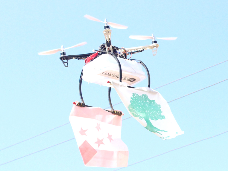 Drone with Nepali Congress pamplet is seen flying over the election meet venue in Sishaghat of Tnahaun district, on Sunday, December 3, 2017. Photo: Madan Wagle