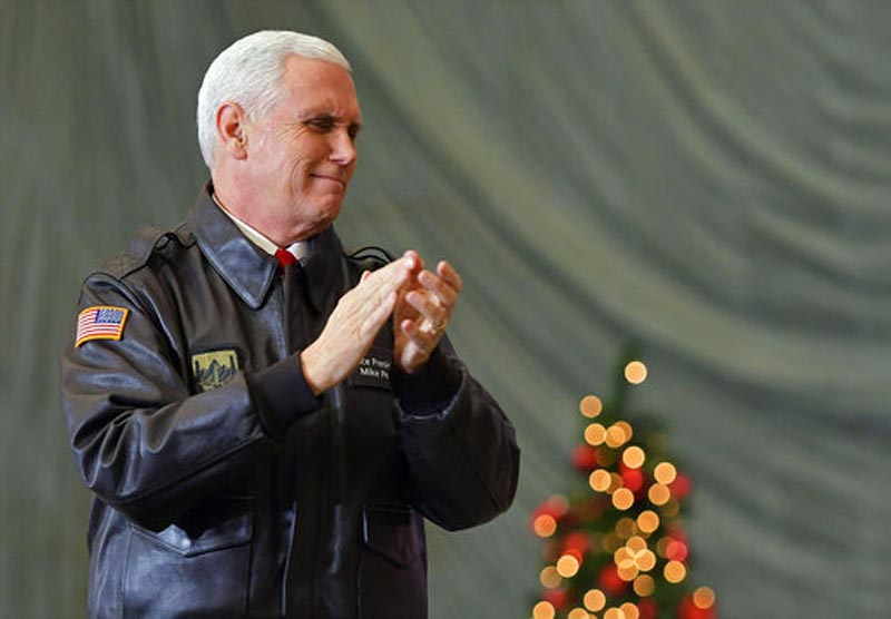 FILE - In this Thursday, Dec. 21, 2017 file photo, U.S. Vice President Mike Pence speaks to troops in a hangar at Bagram Air Base in Afghanistan. Israel's Foreign Ministry said Monday Jan. 1, 2018 that an expected visit by Pence has been postponed again. Pence was scheduled to visit Israel in December 2017. (Mandel Ngan/Pool via AP, File)