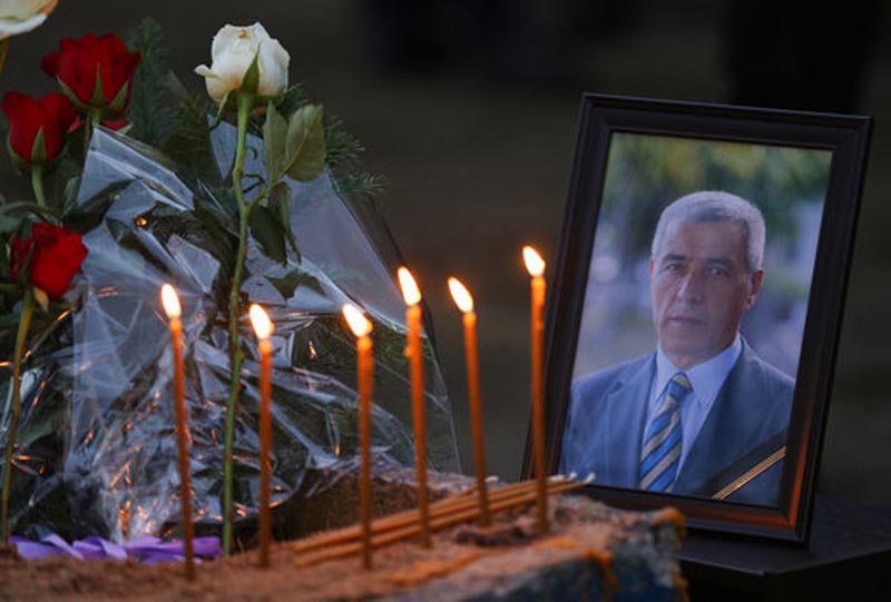 Flowers, candles and a picture of Kosovo Serb politician Oliver Ivanovic, who was shot dead Tuesday morning by still-unknown assailants,  at the scene of the shooting in front of his office in the northern, Serb-dominated part of Mitrovica, Kosovo, Tuesday, Jan. 16, 2018. People from Kosovo's Serb minority say they are in shock over the killing of a moderate politician who was gunned down in an attack in a northern town. Photo: AP