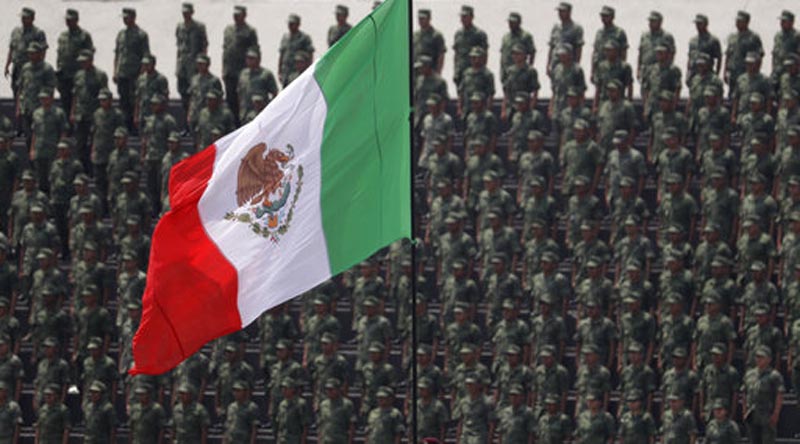 FILE - In this Sept. 13, 2016 photo, cadets attend a graduation ceremony at the Military Academy, in Mexico City. Mexico's Senate approved a law Friday, Dec. 15, 2017, that would give the military legal justification to act as police, despite objections from human rights groups. (AP Photo/Rebecca Blackwell, File)