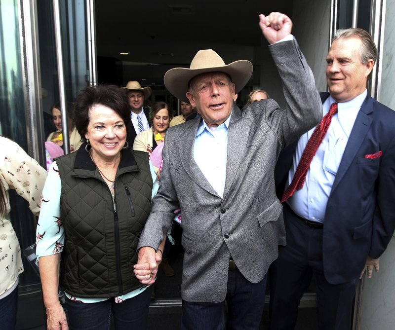 Cliven Bundy walks out of federal court with his wife Carol on Monday, Jan. 8, 2018, in Las Vegas, after a judge dismissed criminal charges against him and his sons accused of leading an armed uprising against federal authorities in  2014