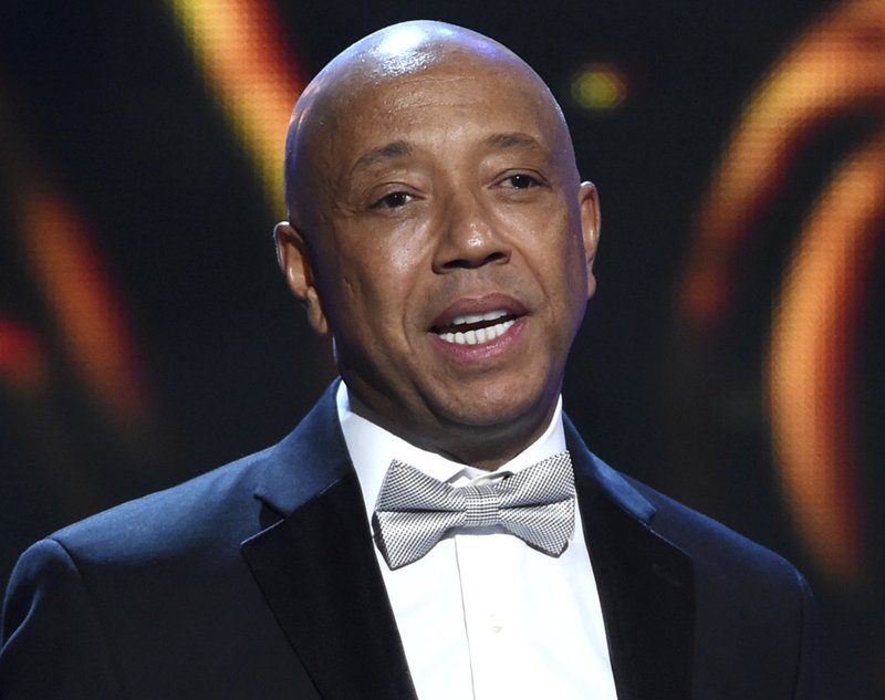 hip-hop mogul Russell Simmons presents the Vanguard Award on stage at the 46th NAACP Image Awards in Pasadena, Calif. A Los Angeles woman is suing Simmons, alleging he raped her at his home in 2016. An attorney for 37-year-old Jennifer Jarosik filed the lawsuit Wednesday, January 24, 2018. Photo: AP