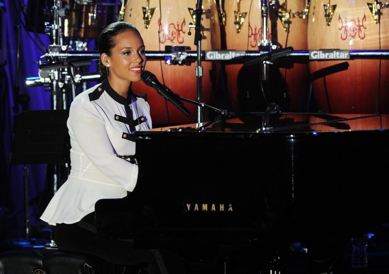 FILE - In this Feb. 11, 2012 file photo, Alicia Keys performs at the Clive Davis pre-Grammy gala in Beverly Hills, Calif. Davisu2019 gala, held a day before the 2018 Grammy Awards, launched the careers of Whitney Houston and Alicia Keys, and have featured all-stars like Aretha Franklin, Carole King, Smokey Robinson and Carly Simon. He first held the gala 42 years ago.
