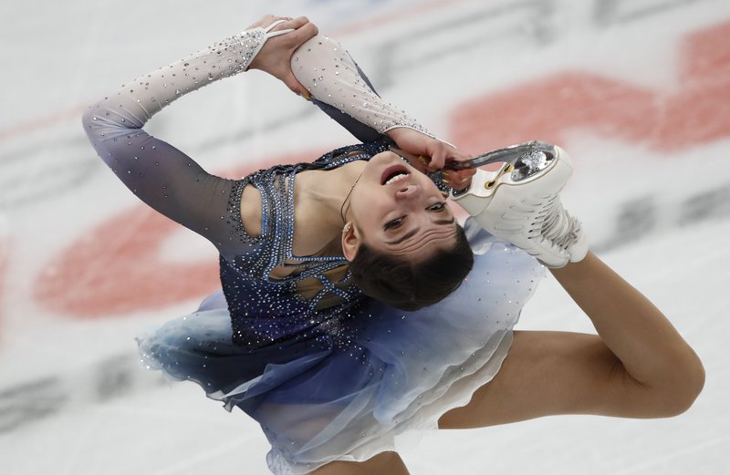 In this Thursday, Jan. 18, 2018, file photo, Evgenia Medvedeva, of Russia, skates her short program at the European figure skating championships in Moscow, Russia. This seemed to be the province of Medvedeva, the Russian dynamo who won the last two world titles and was undefeated since 2015. But in her final major competition before Pyeongchang, she lost to 15-year-old training partner Alina Zagitova at the European Championships. In Moscow, no less